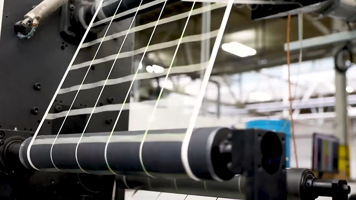 a montage of labels being printed and packaged in a factory